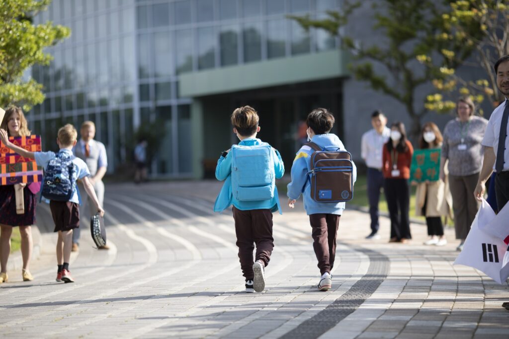 Junior school students on their way into school at NLCS